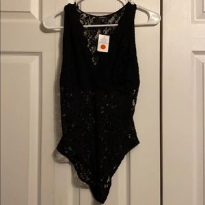 Women’s black lace cut out bodysuit. Tags attached